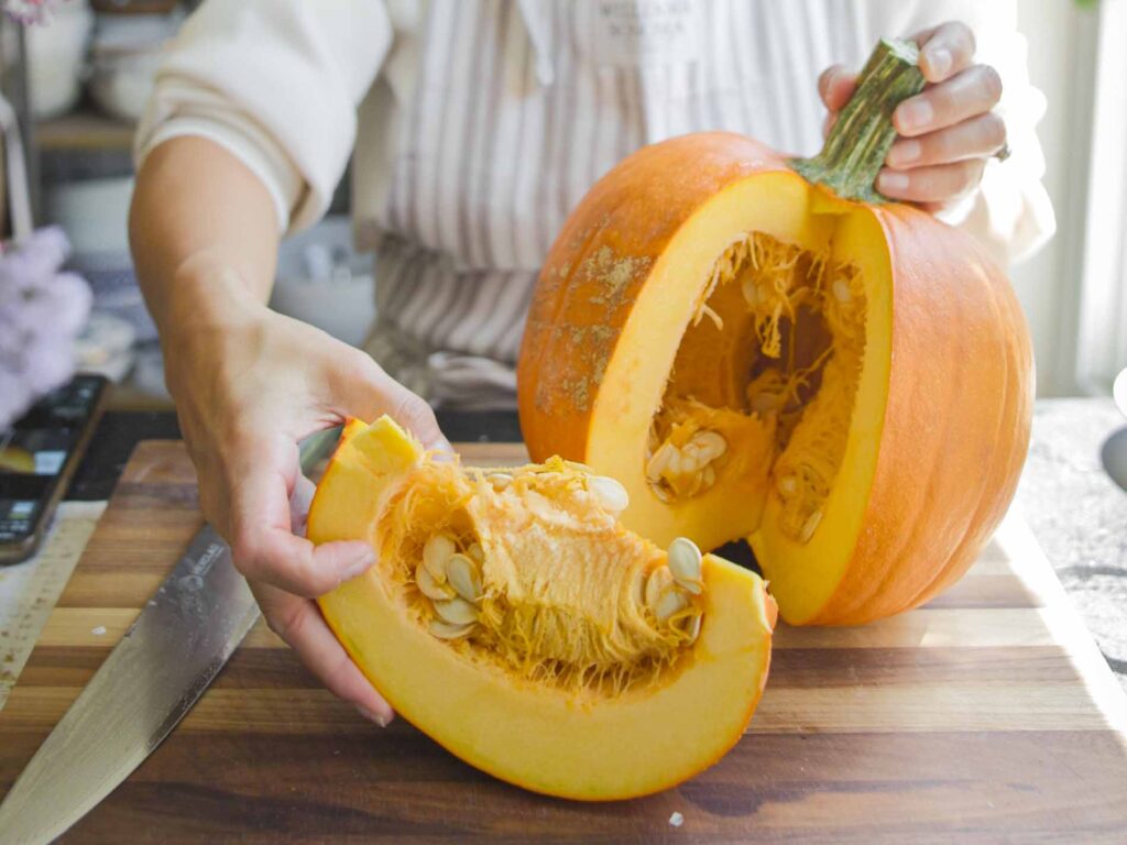 carving up whole pumpkin